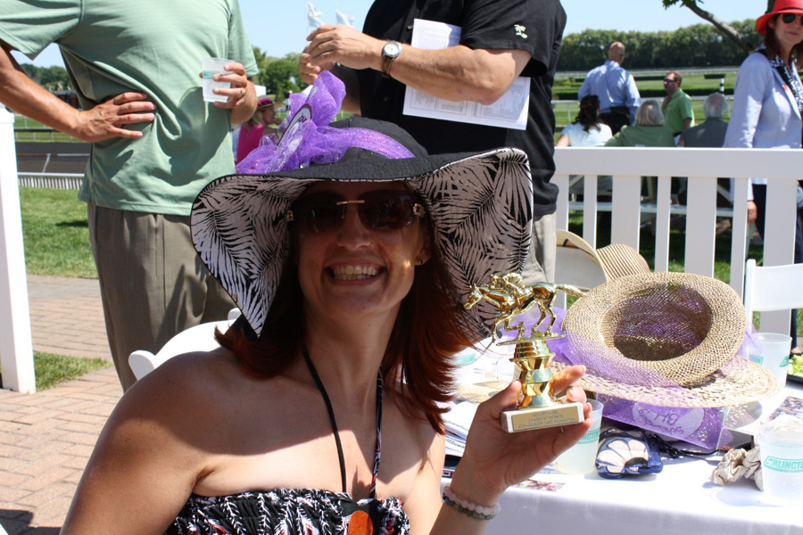 Rebecca-Litgen-with-Hats-Off-trophy.jpg
