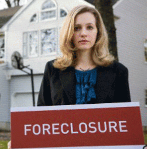 A real estate agent holding a FORECLOSURE sign