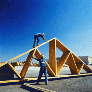 Workers with pre-assembled timber roof section