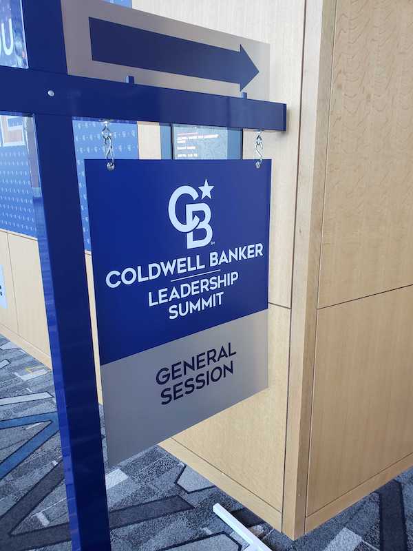 Coldwell Banker sign directing attendees to the general session utilizes the new Project North Star branding